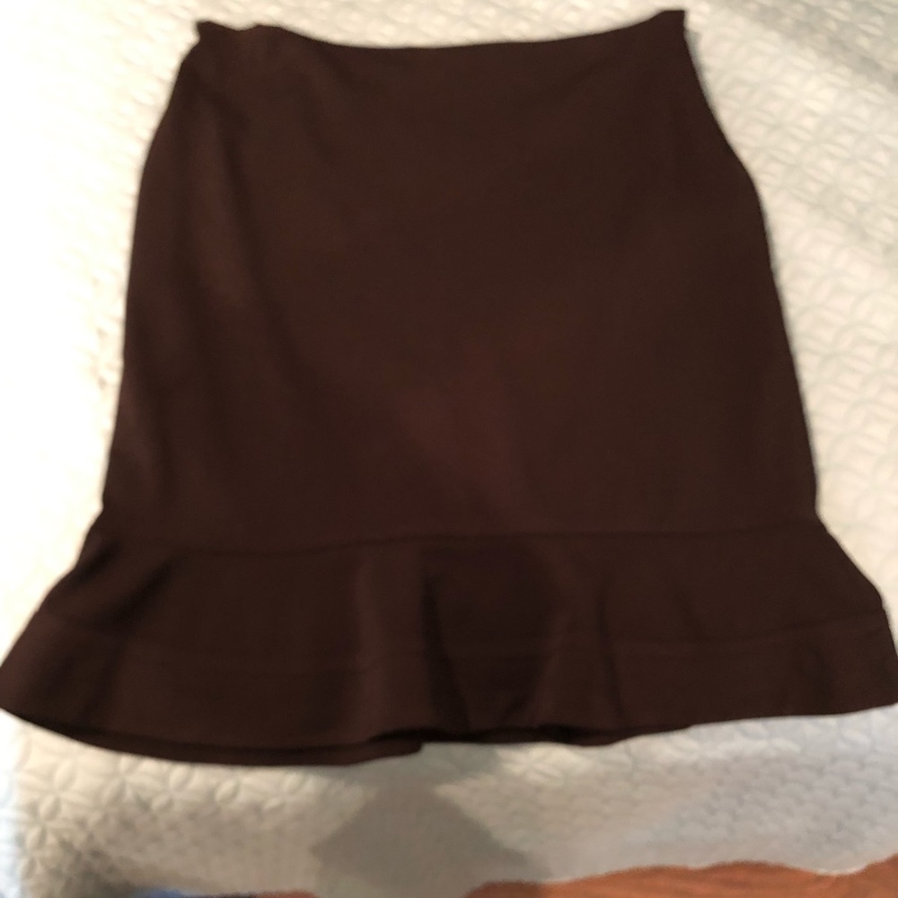Black suit skirt with slight flair.